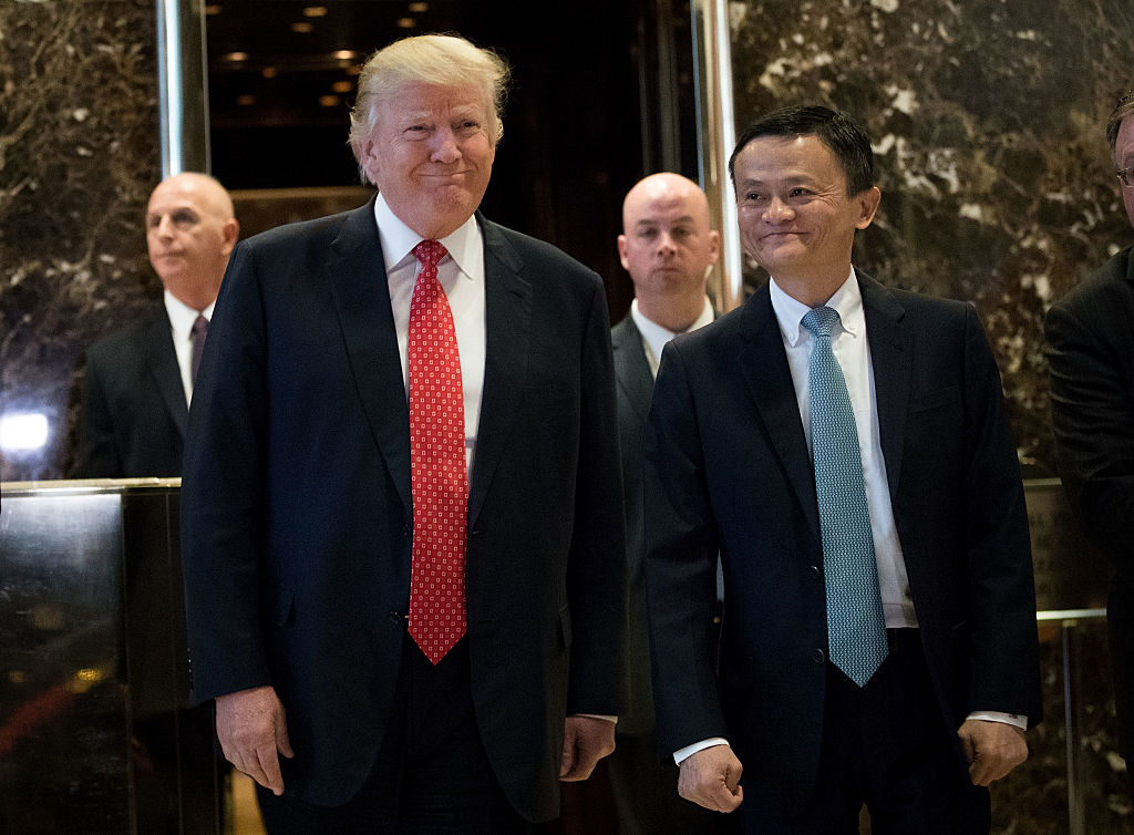NEW YORK, NY - JANUARY 9: (L to R) President-elect Donald Trump and Jack Ma, Chairman of Alibaba Group, emerge from the elevators to speak to reporters following their meeting at Trump Tower, January 9, 2017 in New York City. President-elect Donald Trump and his transition team are in the process of filling cabinet and other high level positions for the new administration. (Photo by Drew Angerer/Getty Images)