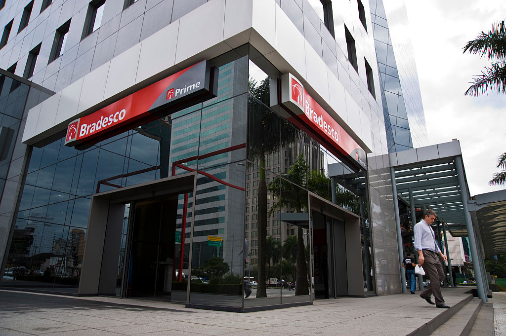 A man walks past a Banco Bradesco SA branch Sao Paulo, Brazil. Bradesco, is Brazil's second-largest non-government bank . (Photo by Paulo Fridman/Corbis via Getty Images)