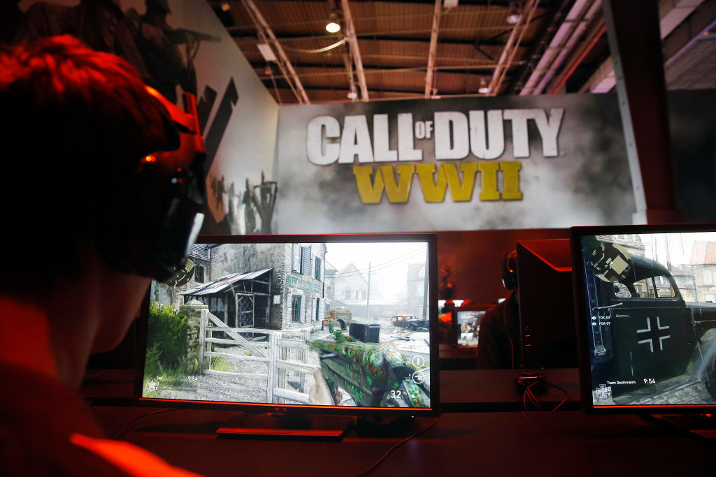 PARIS, FRANCE - NOVEMBER 01:  A gamer plays the video game 'Call of Duty : WWII' developed by Sledgehammer Games and published by Activision during the 'Paris Games Week' on November 01, 2017 in Paris, France. ''Paris Games Week' is an international trade fair for video games to be held from October 31 to November 5, 2017.  (Photo by Chesnot/Getty Images)